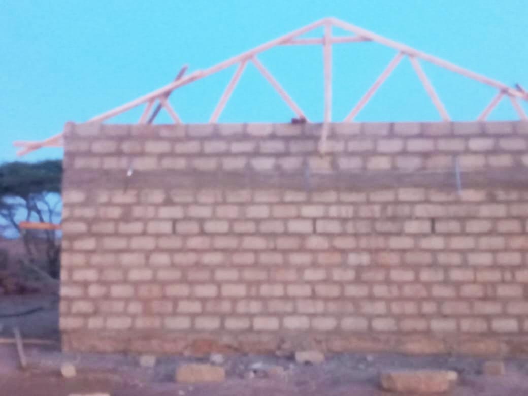 Construction of the roof structure for the classrooms begins.